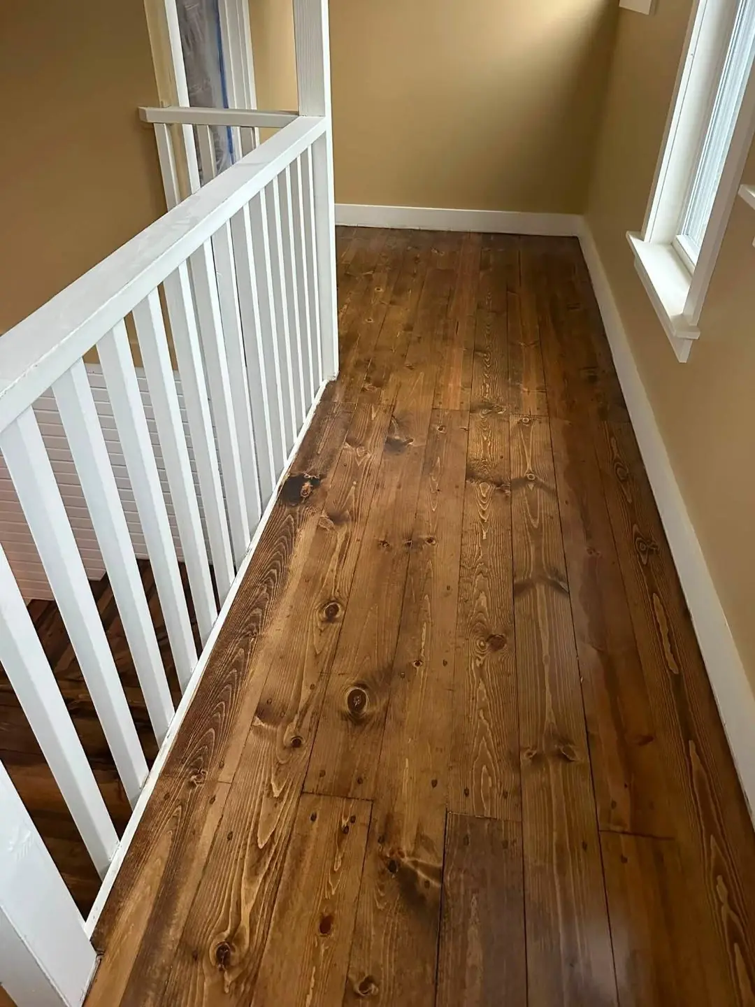 Repaired hardwood boards blended into an existing floor